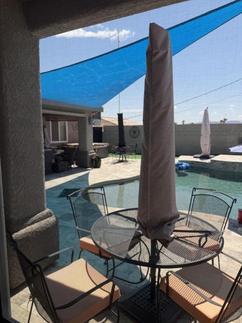Bedroom: View from the King bedroom window. Private table on patio for your enjoyment.