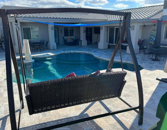 Backyard: Enjoy your morning coffee or an afternoon beverage in our patio swing.