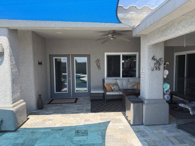 Backyard: Your private entrance from the pool area back into the casita. The sliding door on the right is where the main house connects to the casita. Both the main house and the casita are completely separate with the exception of the pool / patio area.