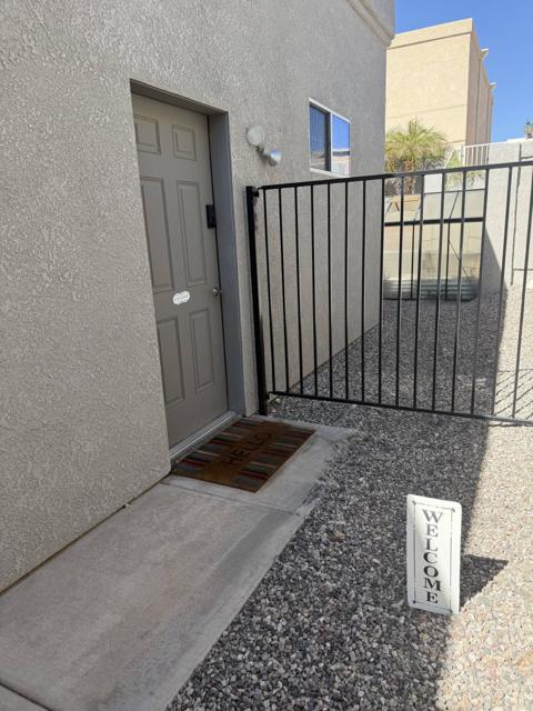 Front yard: Behind the palm-tree gate down the walkway to the SECOND door on the left. You will see this welcome sign. The door code will be the last four digits of your phone number and press the checkmark. It will begin working at 4 pm the day of your arrival.