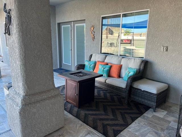 Exterior: Comfy seating and a propane fire pit. Looking to Casita Kitchen Window and private Patio Doors.